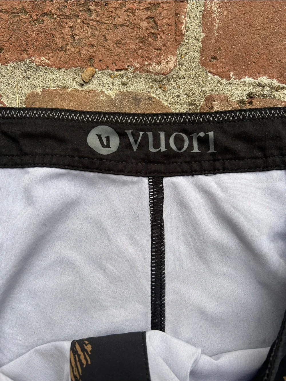 Vuori Black Swim Shorts with Teal & Tan Floral Print